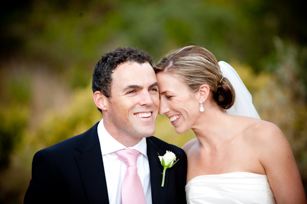 black suit for groom with pink tie - wedding photo by Christine Meintjes Photography
